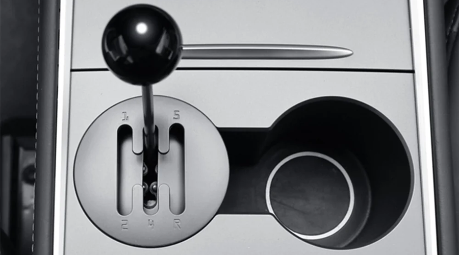 Upgrade Your Tesla Interior with a Quirky Cup Holder Shifter